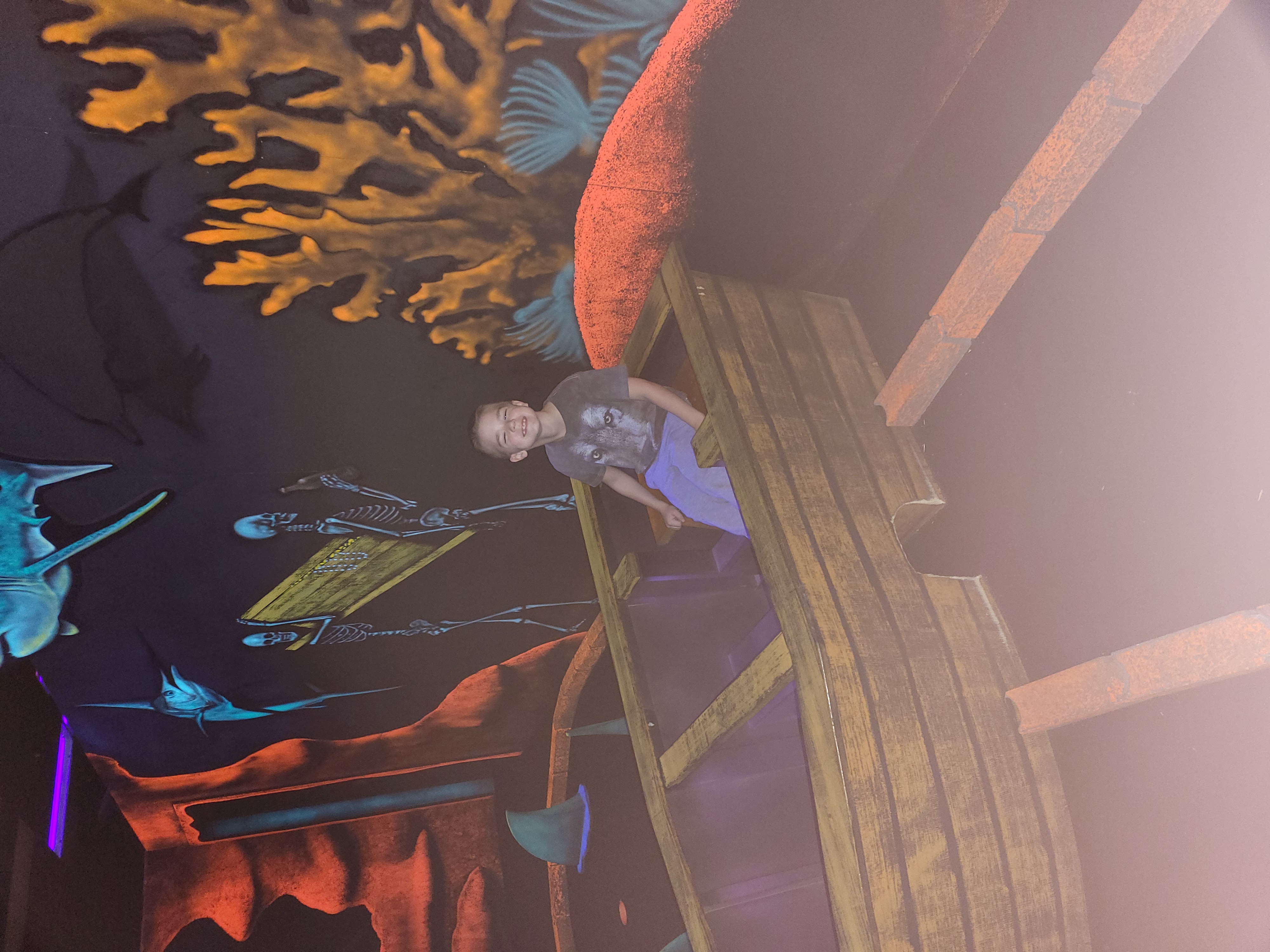 Aden playing glow-in-the-dark mini golf in Spanish Fort, Alabama.