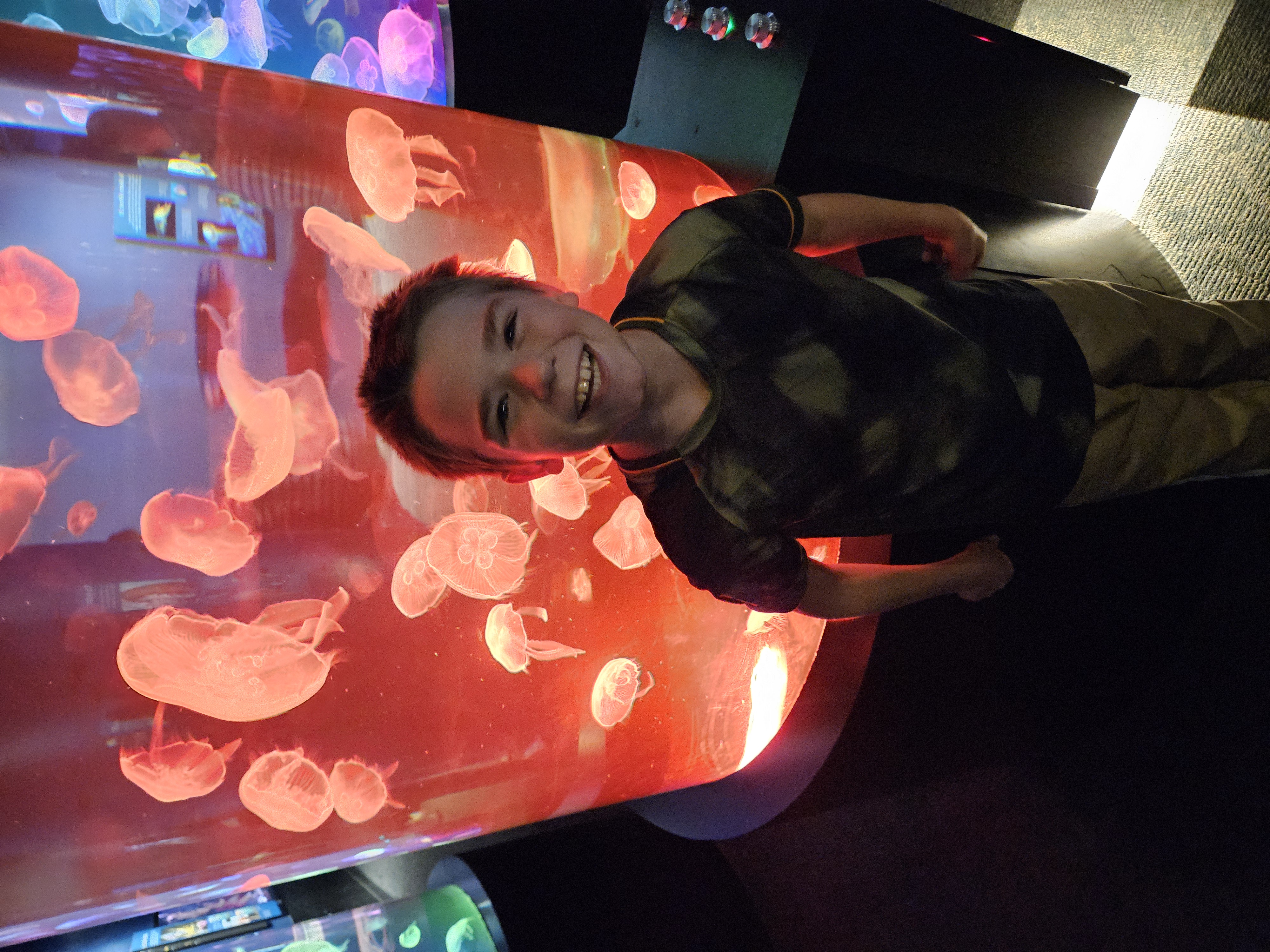 Aden taking a picture of himself during a 2025 visit to the Chattanooga Aquarium